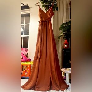 Beautiful flawy dress. Peach in color. In perfect condition and perfect.